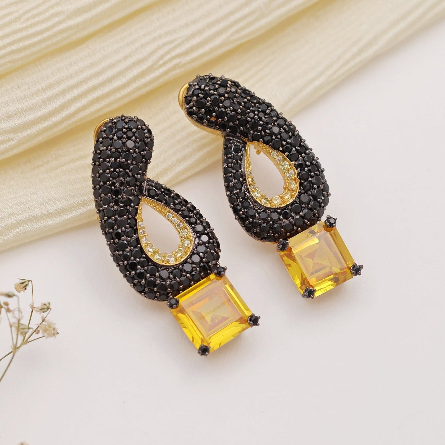 Hanika Black Toned Earrings with Yellow Stone