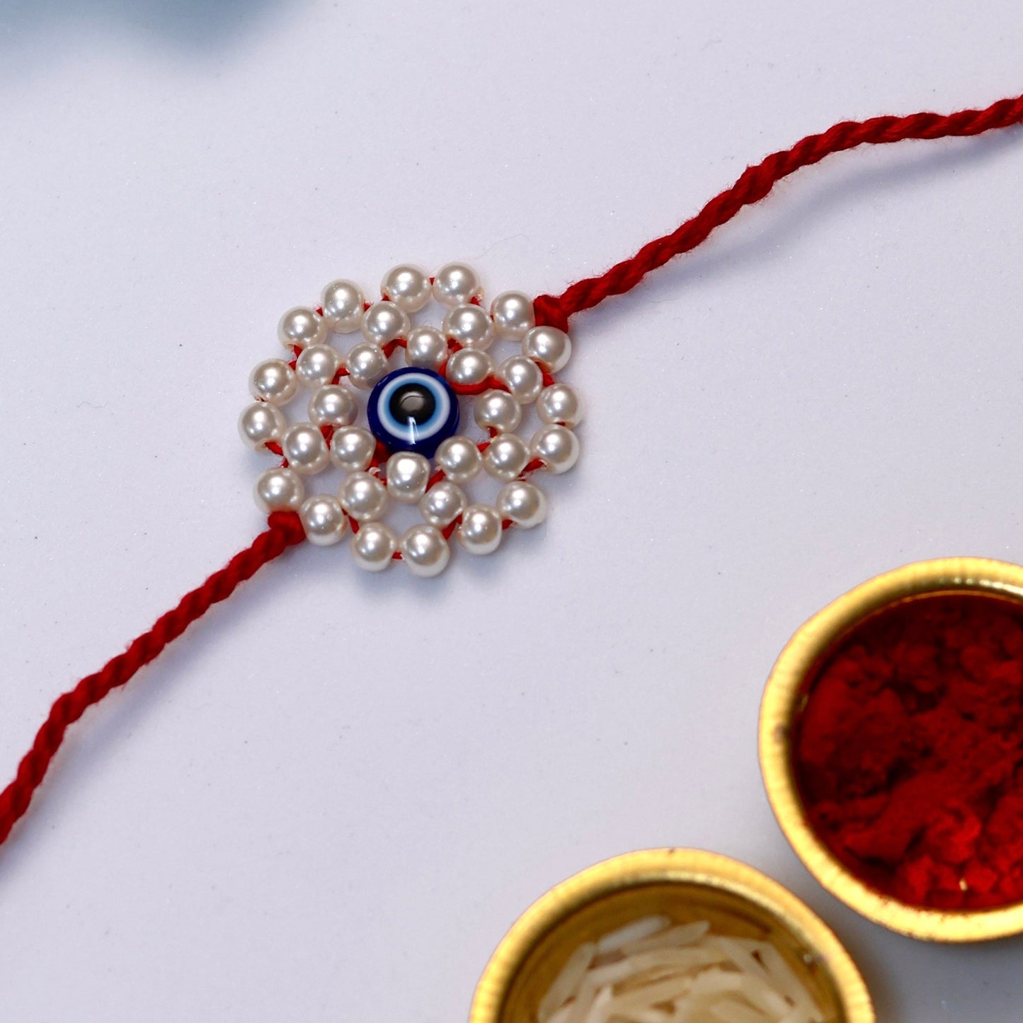 Niharika Pearl Evil Eye Rakhi