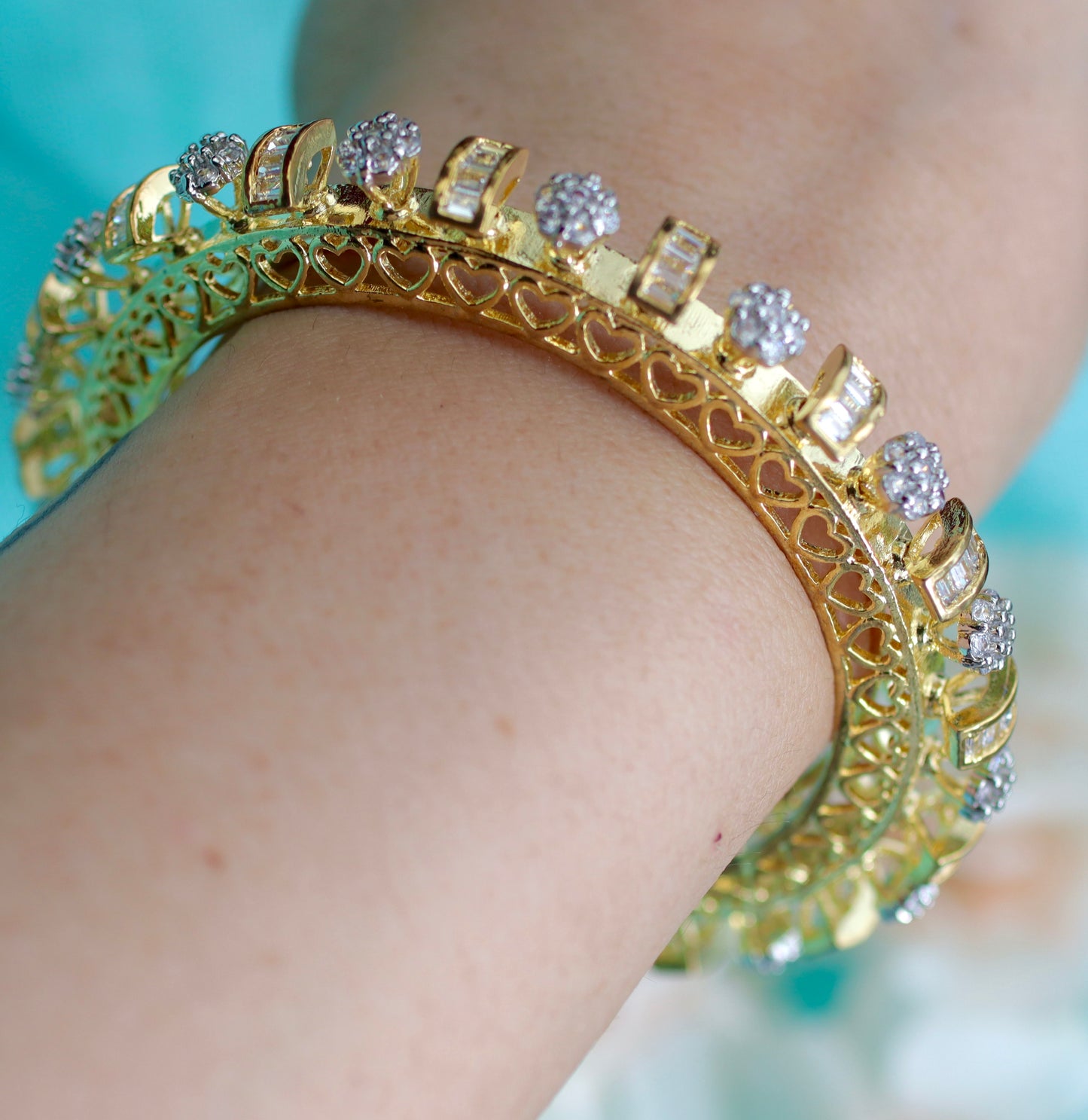 Gold Toned Pacheli Bangle